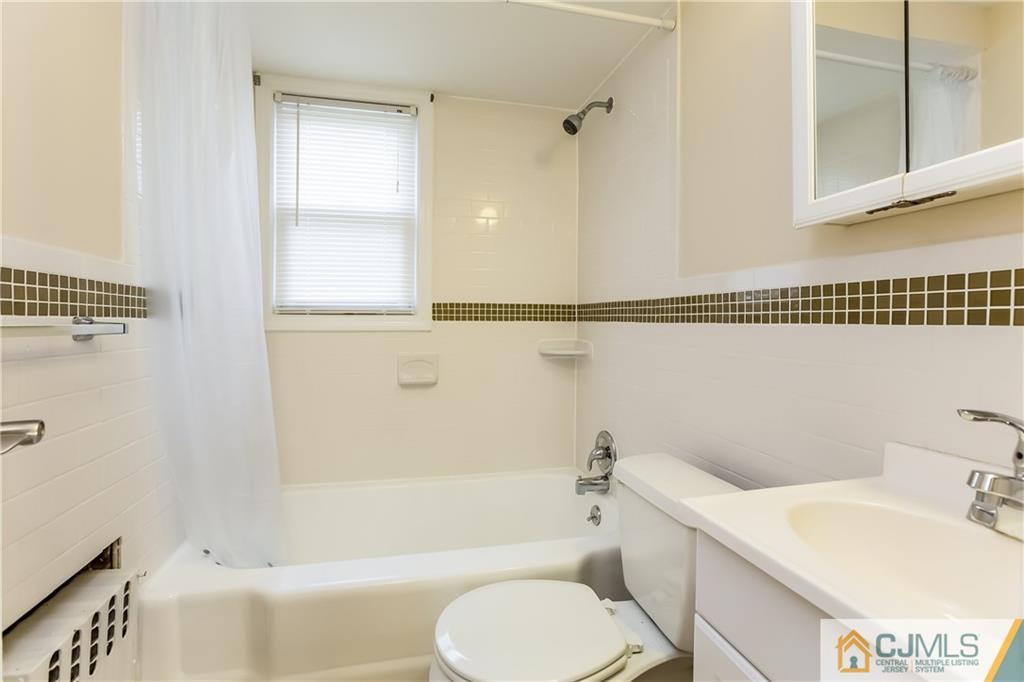 41 West Cliff Road Colonia, NJ 07067 - Photo 8 of 23 a bathroom with a sink toilet and shower