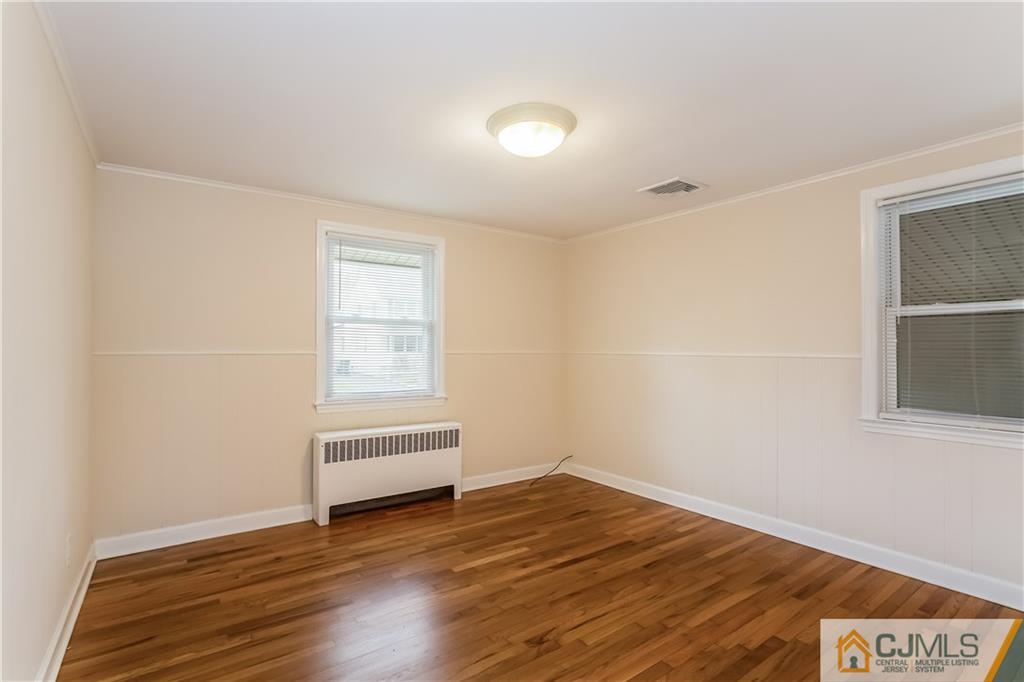 41 West Cliff Road Colonia, NJ 07067 - Photo 10 of 23 a view of wooden floor and windows in a room