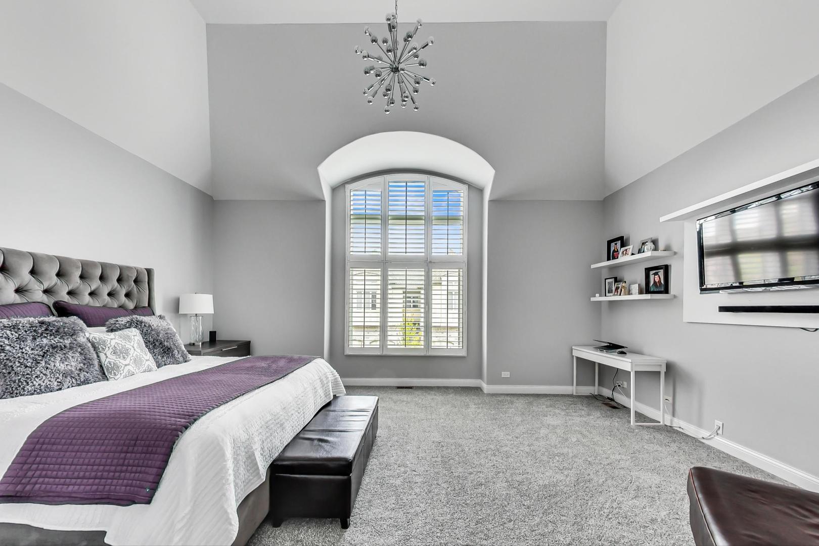 1415 Rue Paris Place Inverness, IL 60067 - Photo 17 of 35 a bedroom with a bed and a chair