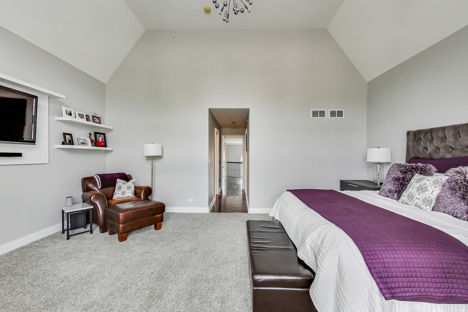 1415 Rue Paris Place Inverness, IL 60067 - Photo 19 of 35 a bedroom with a bed and a flat screen tv