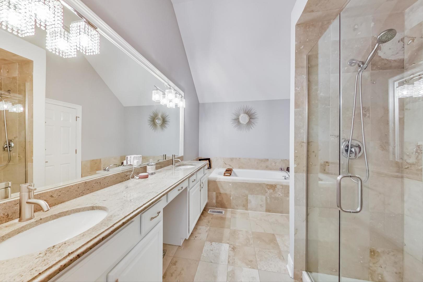 1415 Rue Paris Place Inverness, IL 60067 - Photo 20 of 35 a spacious bathroom with a granite countertop sink a toilet a mirror and shower