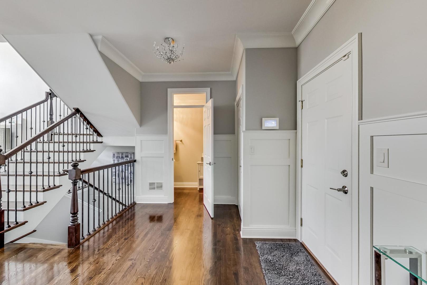 1415 Rue Paris Place Inverness, IL 60067 - Photo 4 of 35 a view of a hallway with wooden floor and entryway