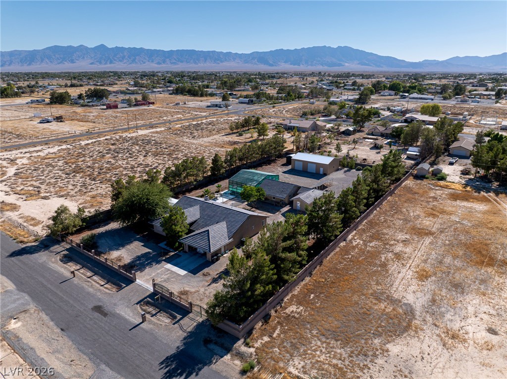 3780 South Ranger Way Pahrump, NV 89048 - Photo 4 of 57 An aerial perspective reveals a private desert oasis with mature landscaping and mountain views.