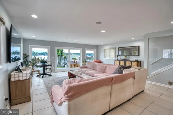 a kitchen with stainless steel appliances granite countertop a refrigerator a stove and a sink