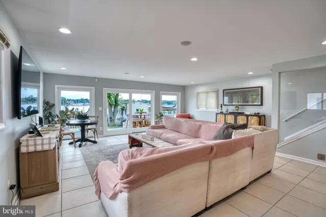 a kitchen with stainless steel appliances granite countertop a refrigerator a stove and a sink