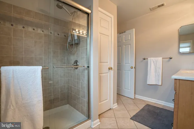 a bathroom with a sink a toilet and shower curtain