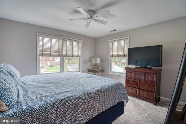 a bed room with a bed and a couch