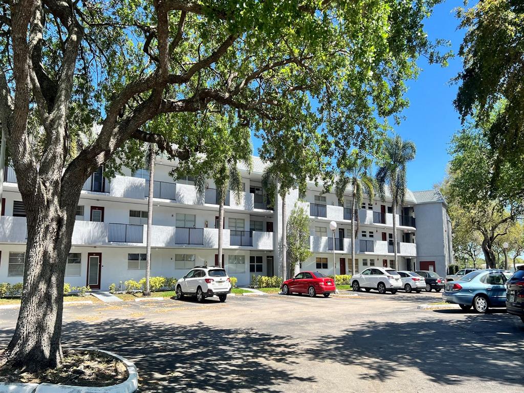 a view of a street with cars