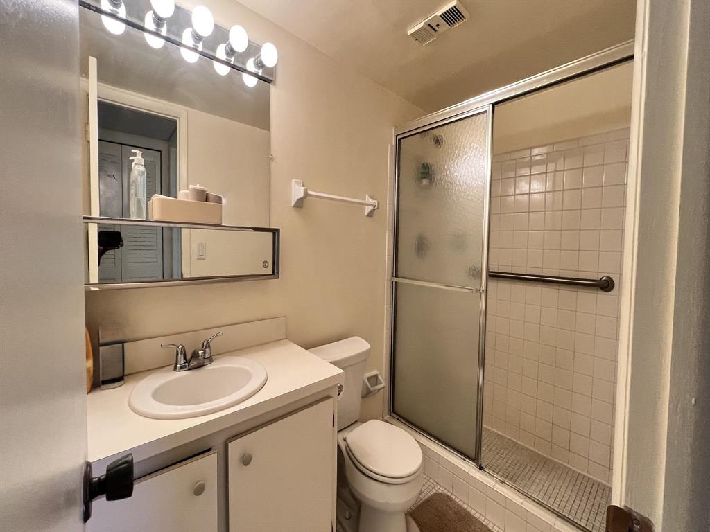 8305 Northwest 61st Street, Unit 203 Tamarac, FL 33321 - Photo 6 of 13 a bathroom with a sink toilet and shower