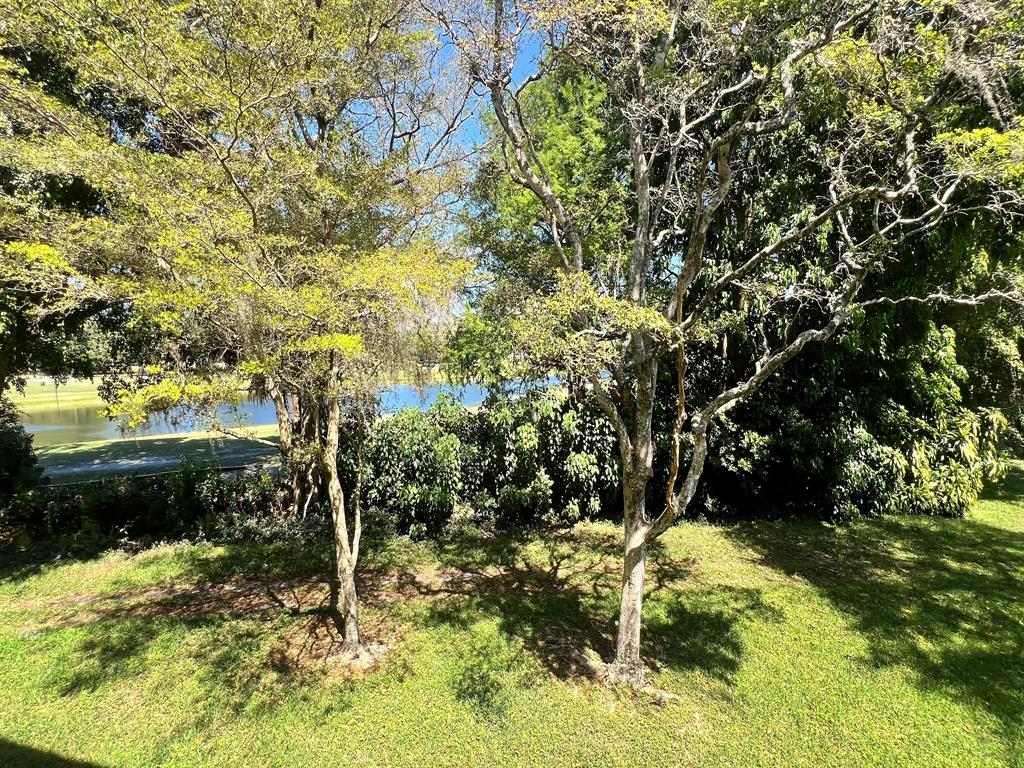 8305 Northwest 61st Street, Unit 203 Tamarac, FL 33321 - Photo 9 of 13 a view of a yard