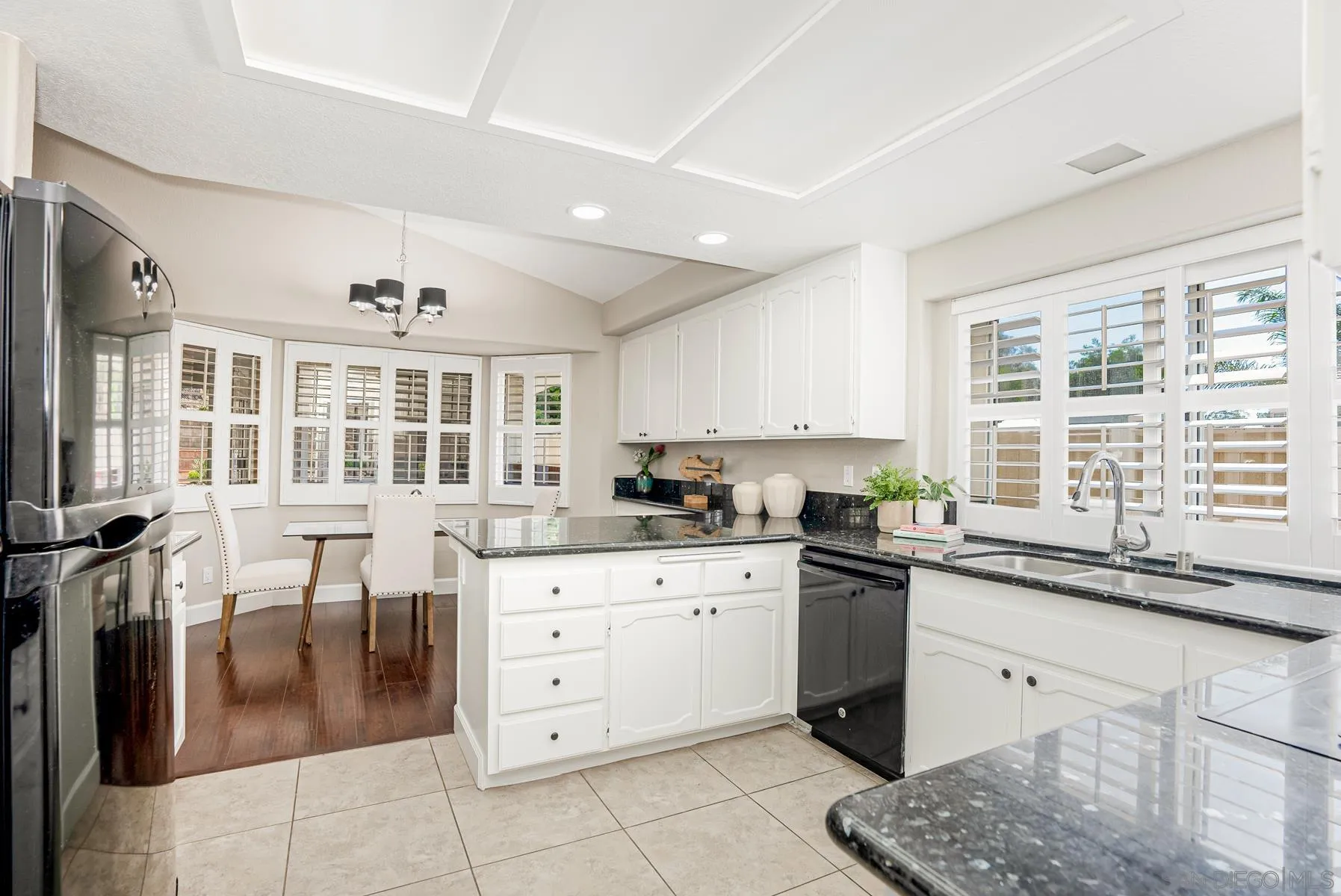 13893 Carriage Road Poway, CA 92064 - Photo 13 of 71 a kitchen with granite countertop a sink a stove and cabinets