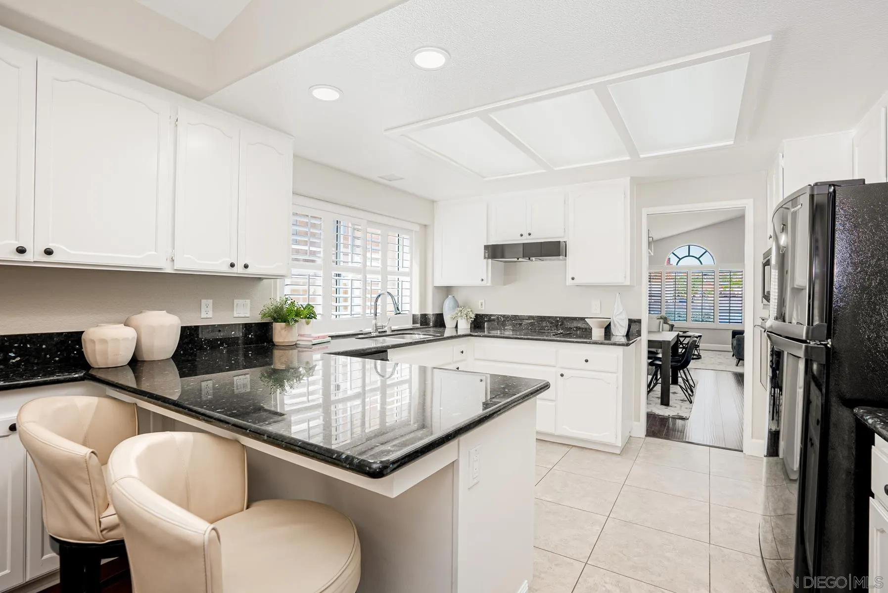 13893 Carriage Road Poway, CA 92064 - Photo 14 of 71 a kitchen with stainless steel appliances granite countertop a sink refrigerator and cabinets