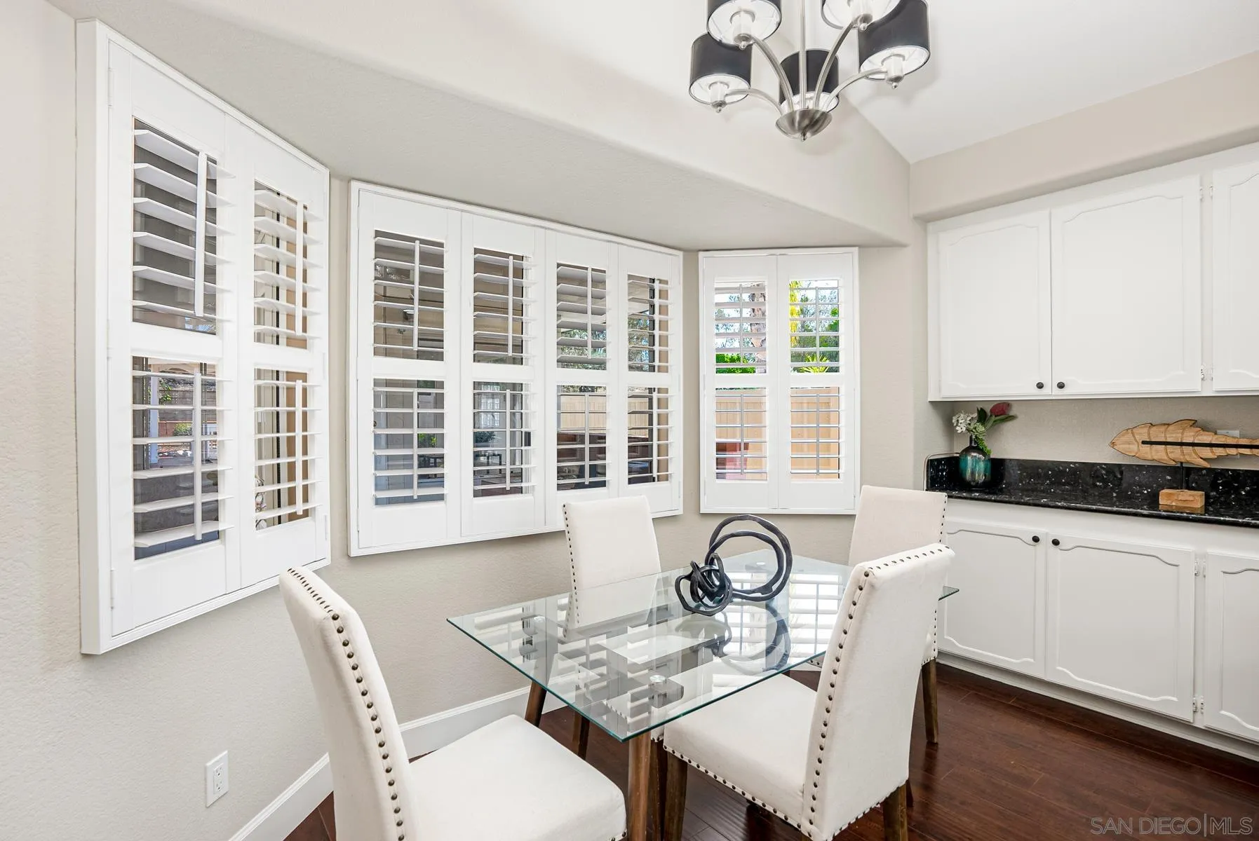 13893 Carriage Road Poway, CA 92064 - Photo 17 of 71 a view of a dining room with furniture window and wooden floor
