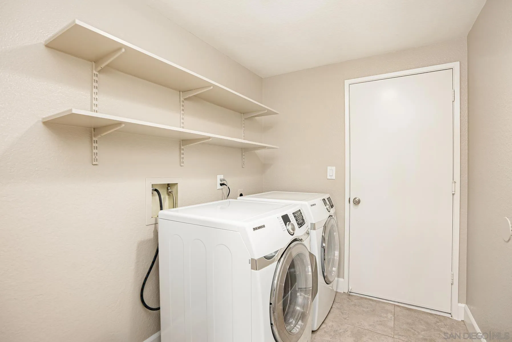 13893 Carriage Road Poway, CA 92064 - Photo 29 of 71 a utility room with dryer and washer