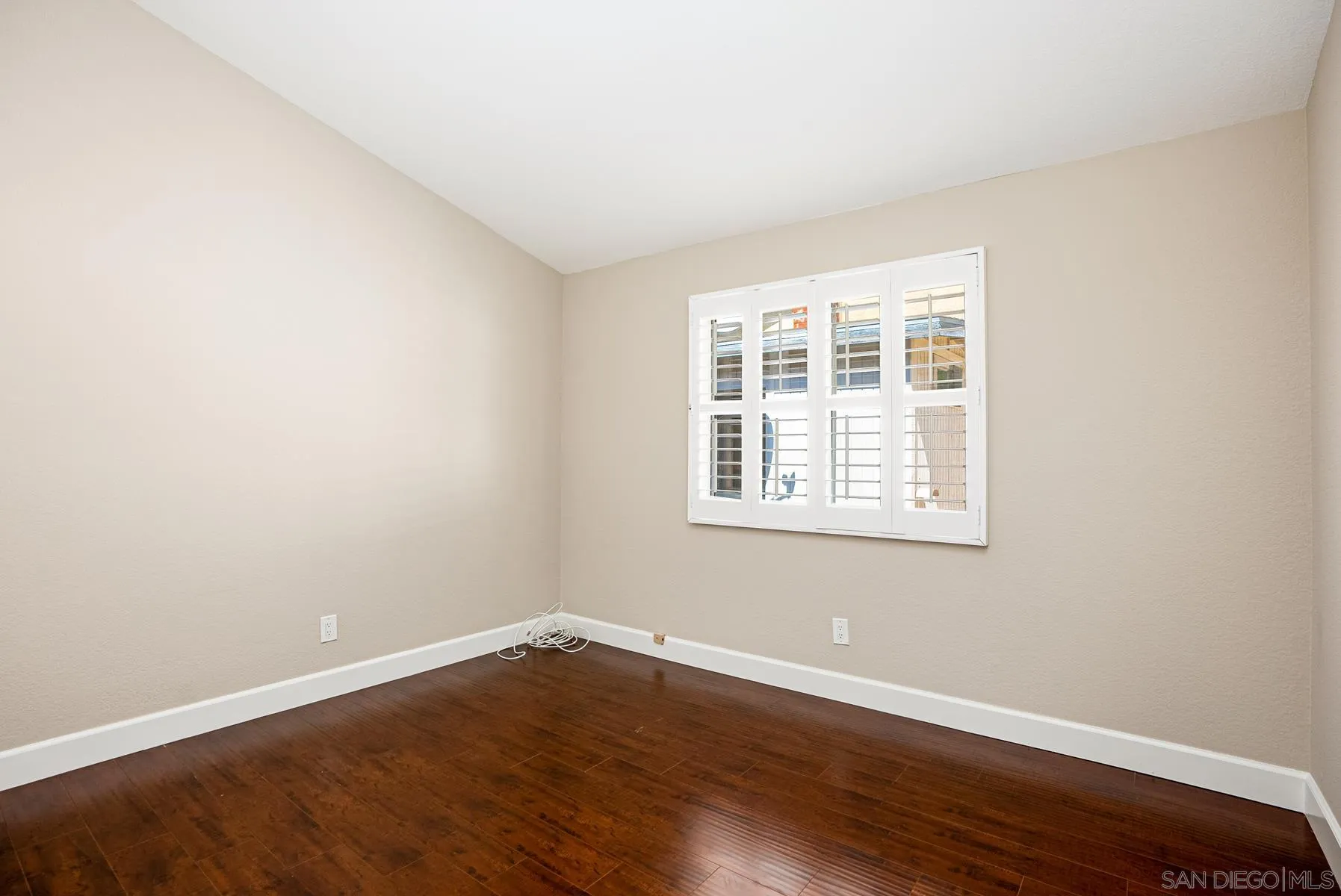 13893 Carriage Road Poway, CA 92064 - Photo 30 of 71 an empty room with wooden floor and windows