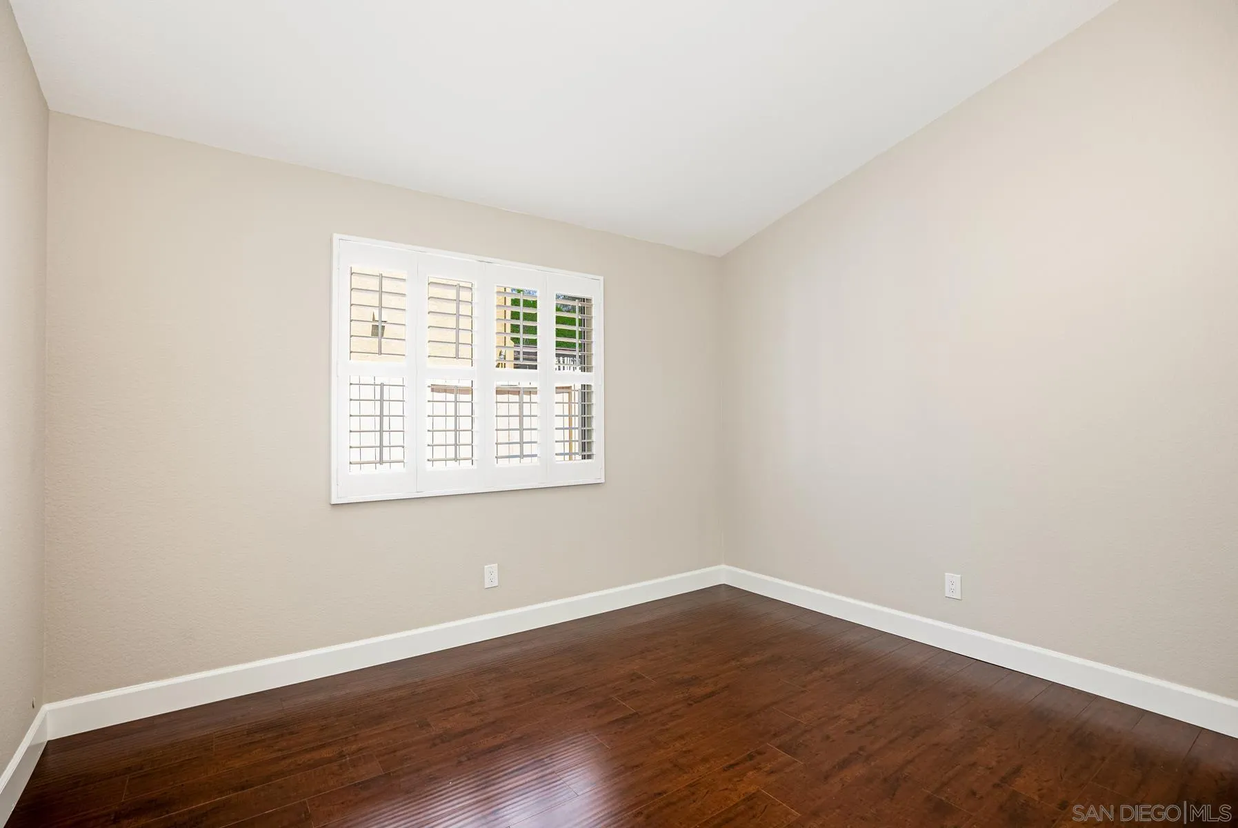 13893 Carriage Road Poway, CA 92064 - Photo 32 of 71 an empty room with wooden floor and windows