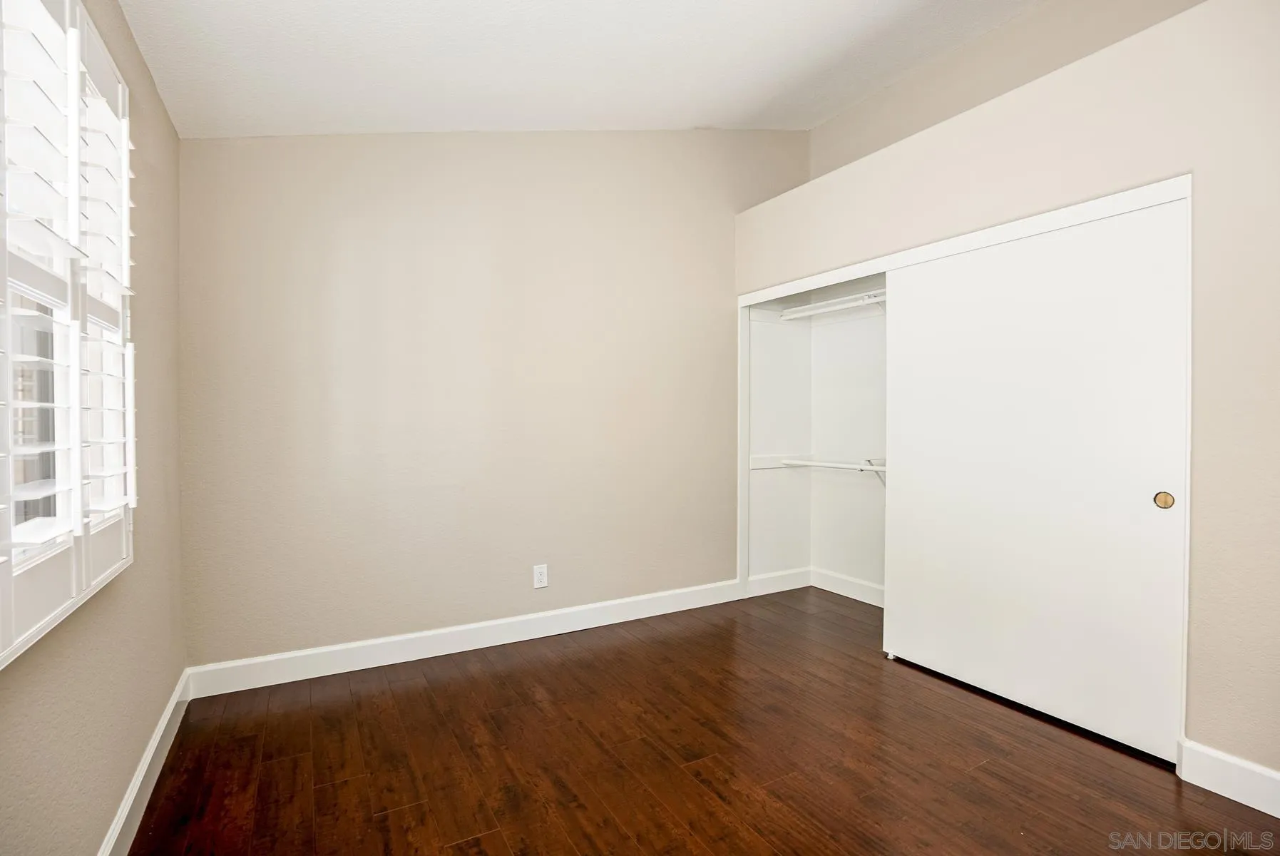 13893 Carriage Road Poway, CA 92064 - Photo 33 of 71 an empty room with wooden floor and windows