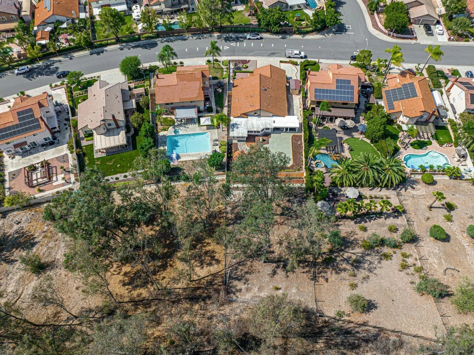 13893 Carriage Road Poway, CA 92064 - Photo 49 of 71 an aerial view of residential houses with outdoor space and parking