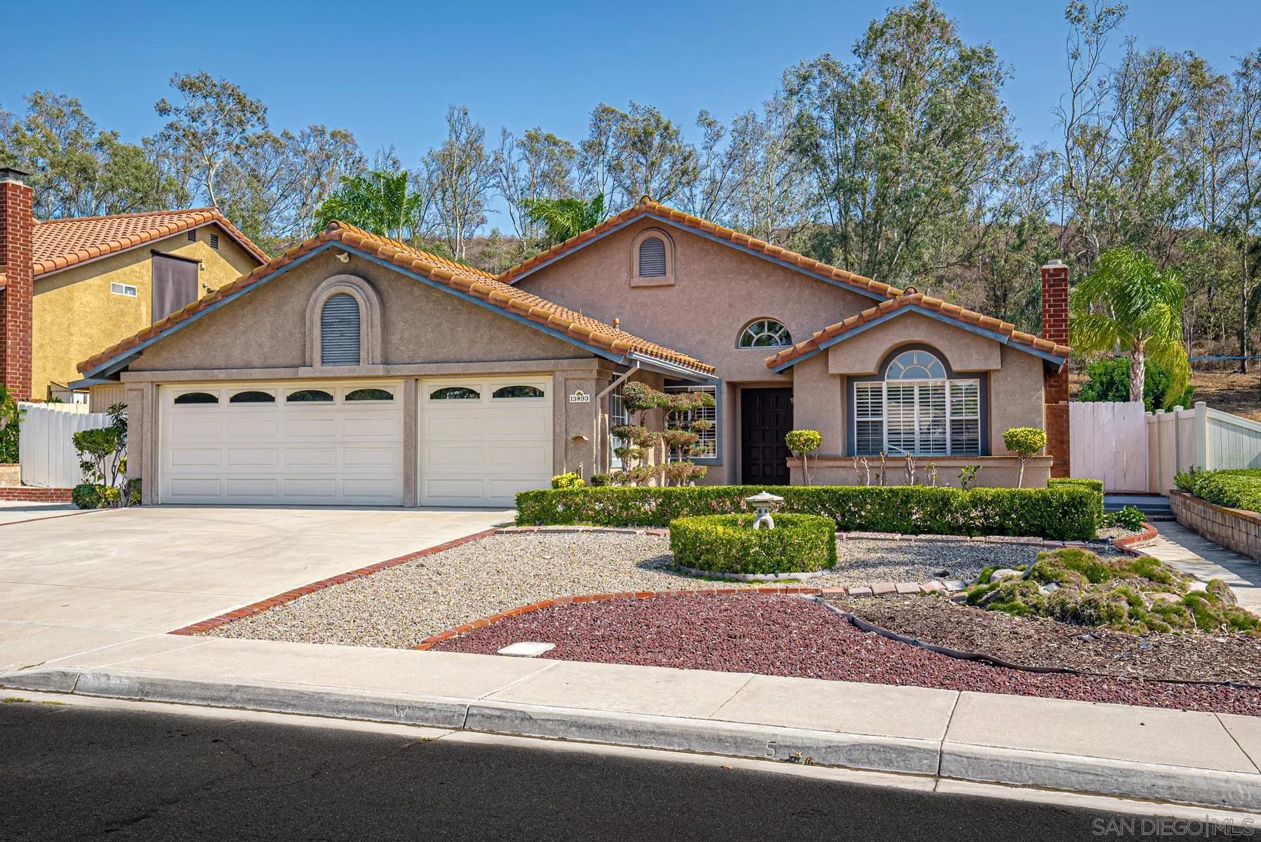 13893 Carriage Road Poway, CA 92064 - Photo 60 of 71 a front view of a house with a garden