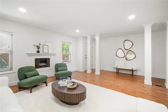 a living room with furniture and a fireplace