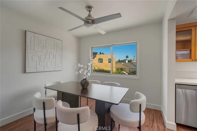 a kitchen with kitchen island granite countertop a sink stainless steel appliances and cabinets