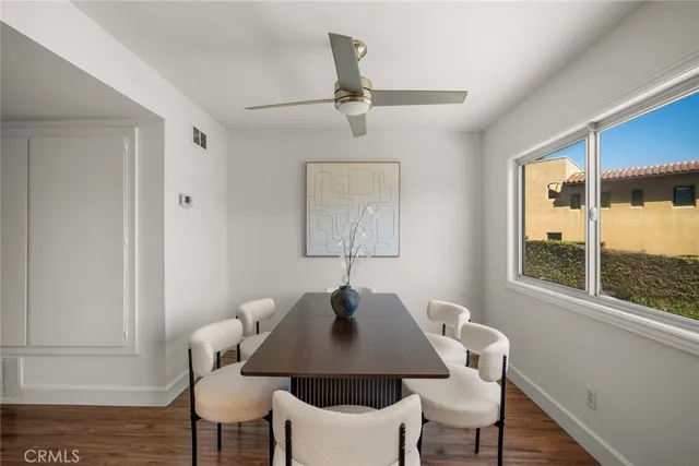 a kitchen with granite countertop a sink stainless steel appliances and cabinets