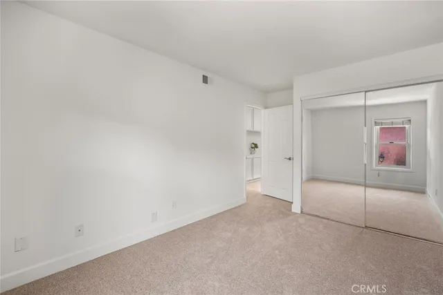 a view of a lake with table and chairs