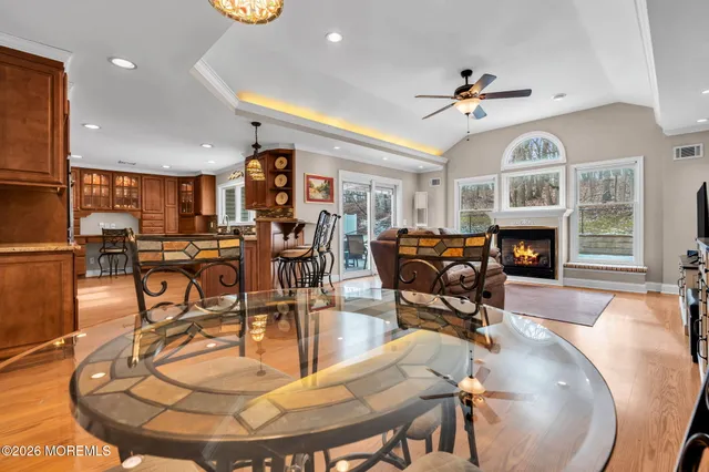 a living room with fireplace furniture and a wooden floor