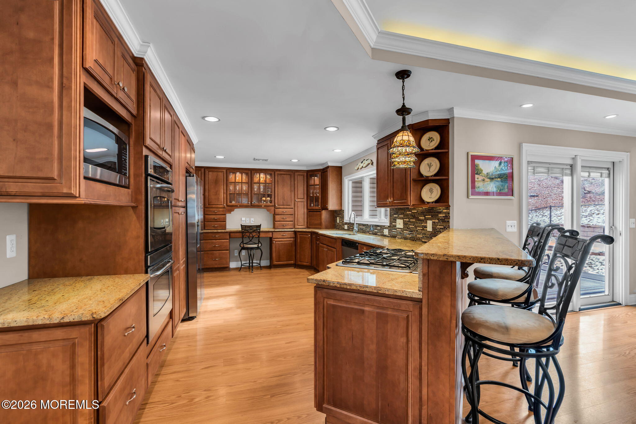 48 Newbury Road Howell, NJ 07731 - Photo 14 of 41 a kitchen with stainless steel appliances granite countertop a stove and a refrigerator