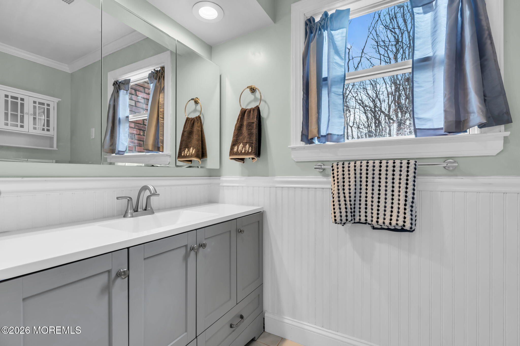 48 Newbury Road Howell, NJ 07731 - Photo 16 of 41 a bathroom with a sink and a mirror