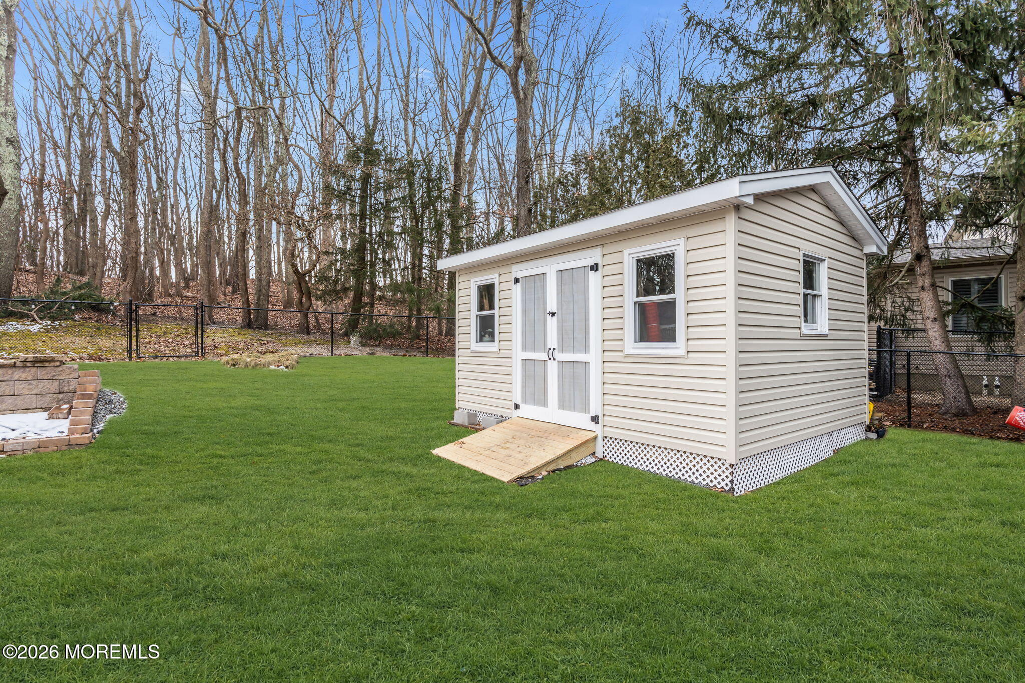 48 Newbury Road Howell, NJ 07731 - Photo 20 of 41 a front view of a house with a yard