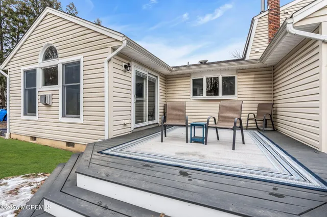 a house view with a garden and deck