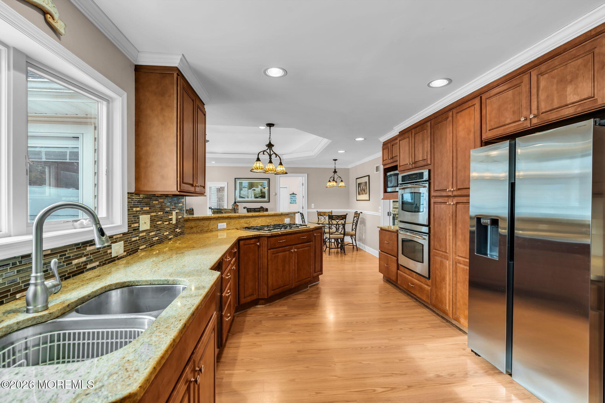 48 Newbury Road Howell, NJ 07731 - Photo 4 of 41 a kitchen with stainless steel appliances granite countertop a sink and a refrigerator