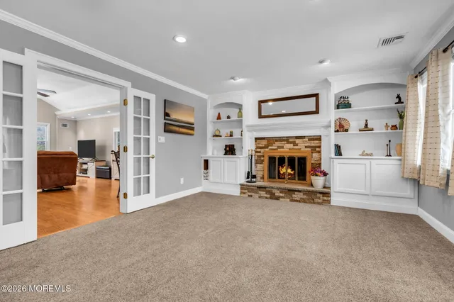 a view of a livingroom with furniture and a fireplace
