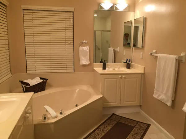 a bathroom with a bathtub and a sink