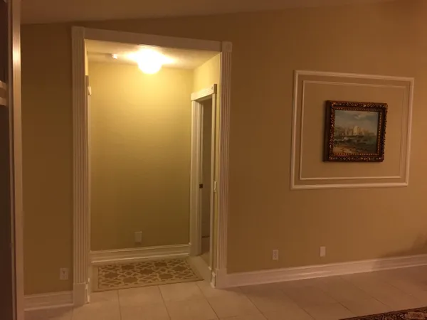 a bedroom with a bed and a mirror