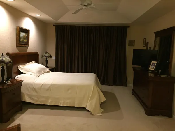 a bathroom with a tub and a glass door