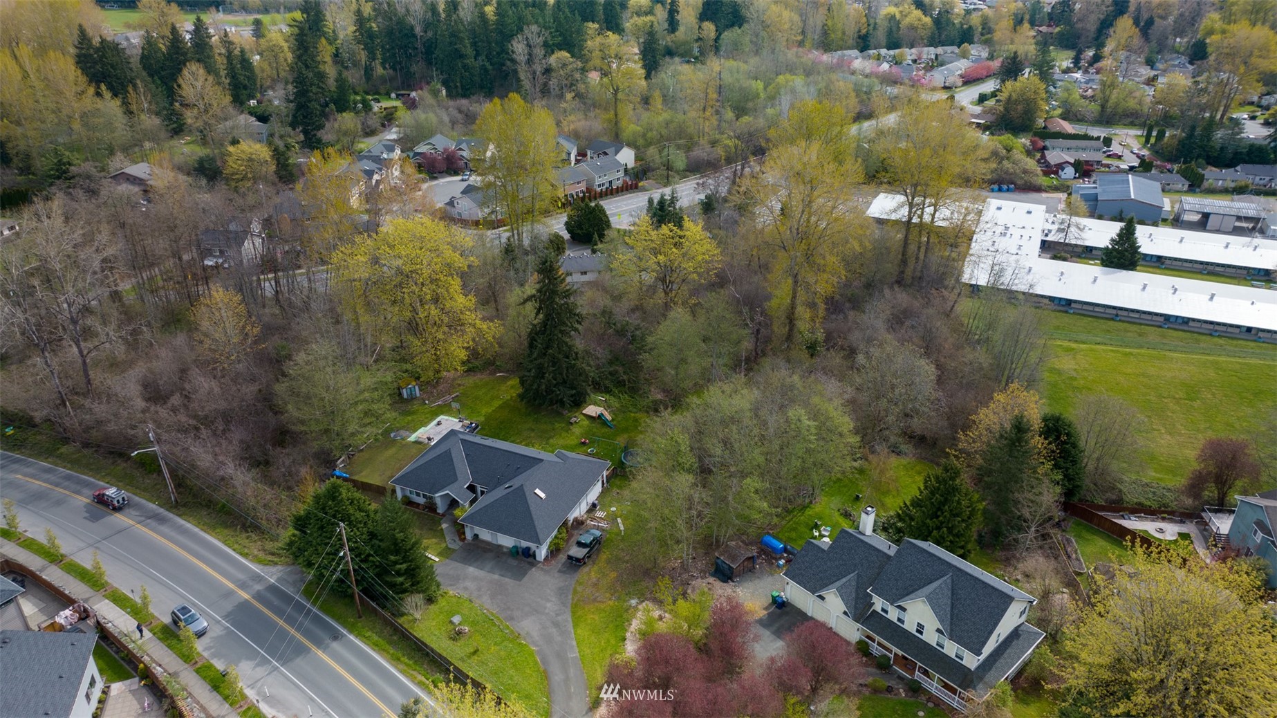 24121 Locust Way Bothell, WA 98021 - Photo 1 of 12 an aerial view of residential houses with outdoor space