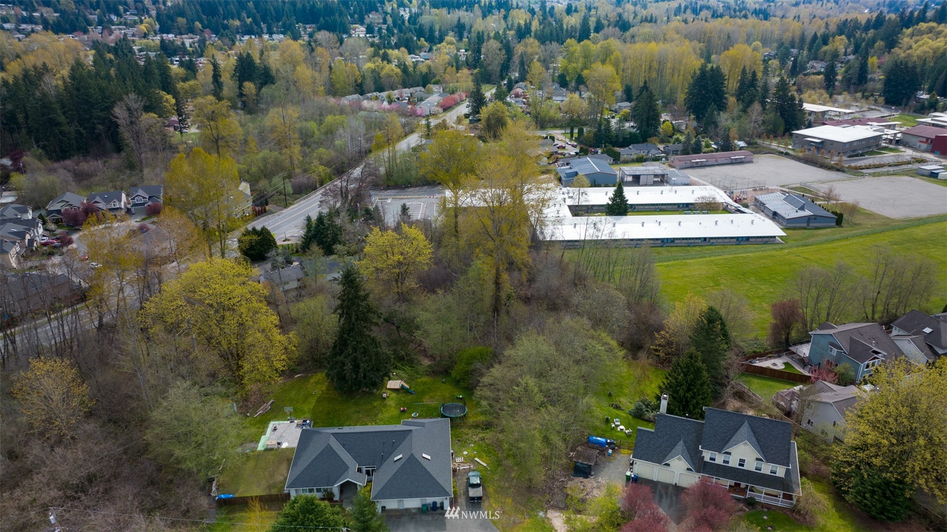 24121 Locust Way Bothell, WA 98021 - Photo 2 of 12 an aerial view of residential houses with outdoor space