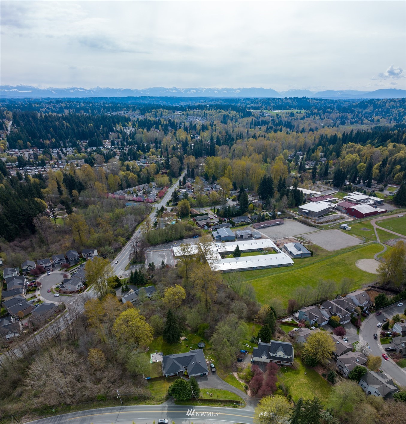 24121 Locust Way Bothell, WA 98021 - Photo 3 of 12 a view of a city with mountains in the background