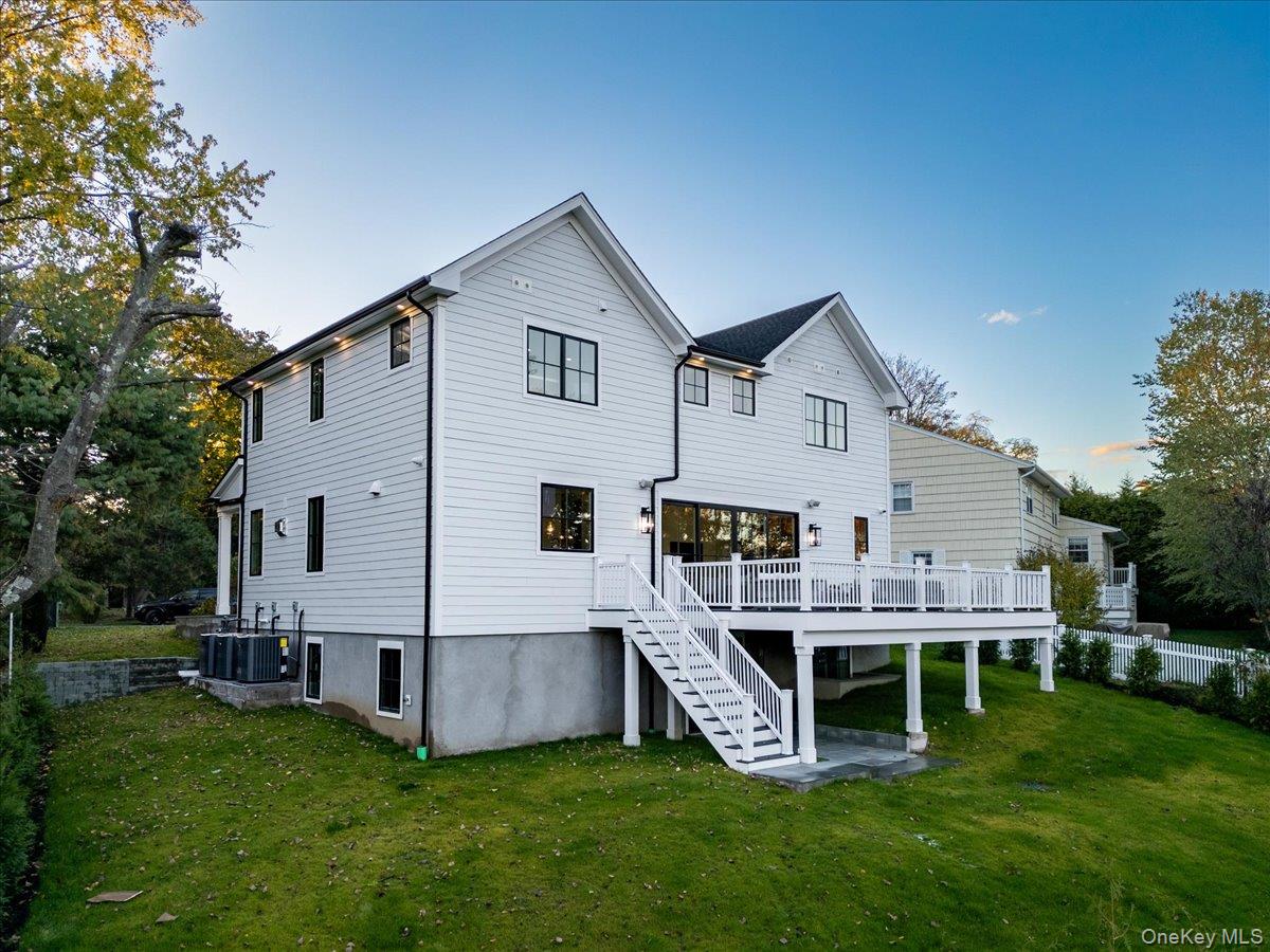 50 Franklin Avenue Rye, NY 10580 - Photo 29 of 45 a view of a house with a yard and deck