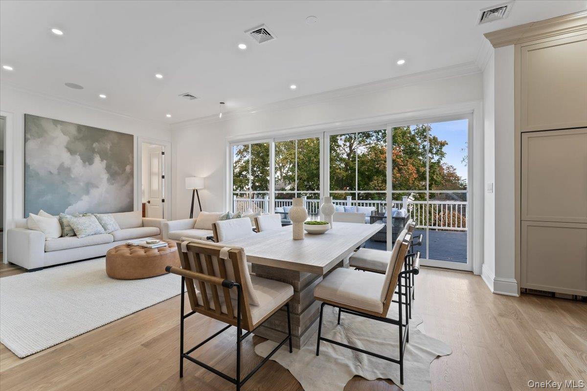 50 Franklin Avenue Rye, NY 10580 - Photo 5 of 45 a dining room with furniture and a large window