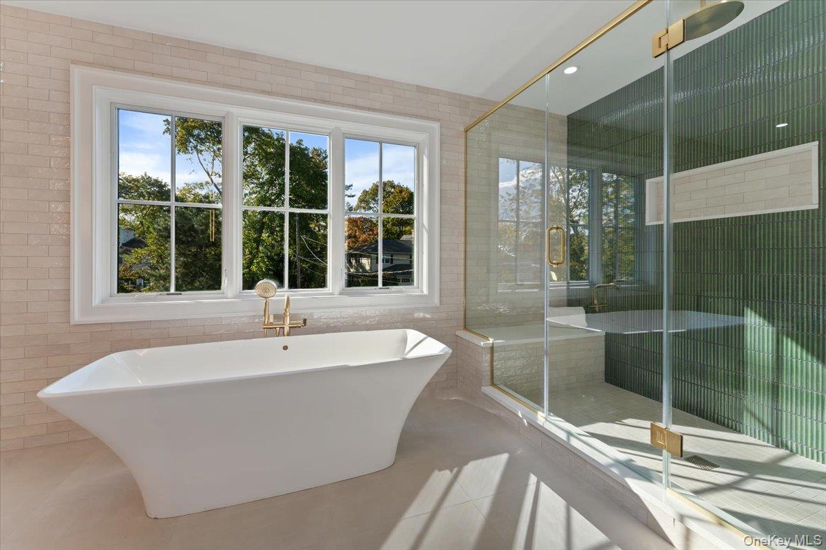50 Franklin Avenue Rye, NY 10580 - Photo 8 of 45 a white bath tub sitting next to a window