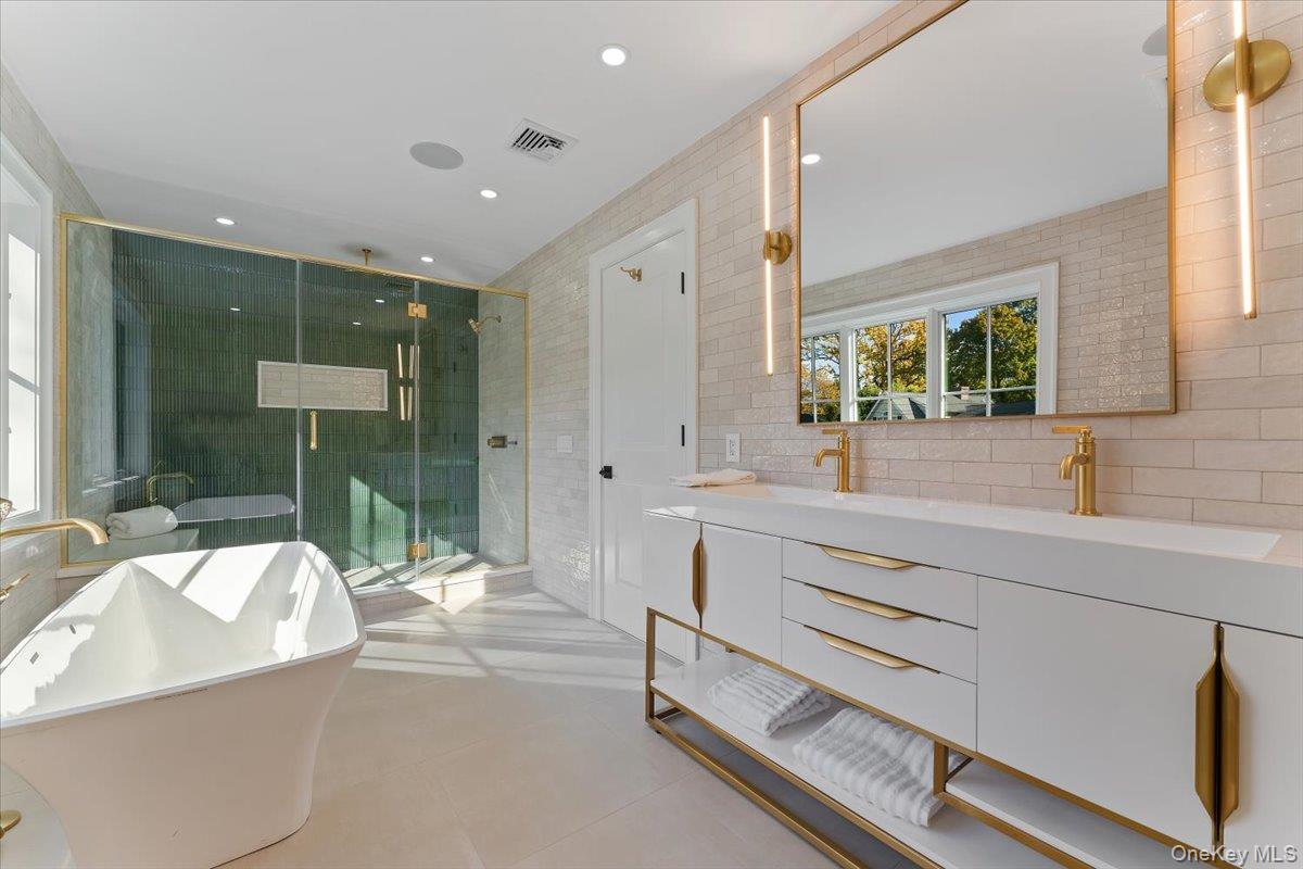 50 Franklin Avenue Rye, NY 10580 - Photo 9 of 45 a bathroom with a tub sink and mirror