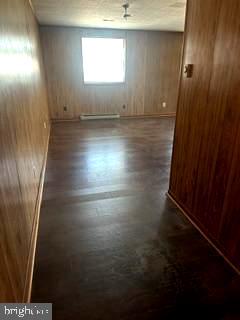 21628 Great Mills Road, Unit A2 Lexington Park, MD 20653 - Photo 2 of 11 an empty room with wooden floor and windows