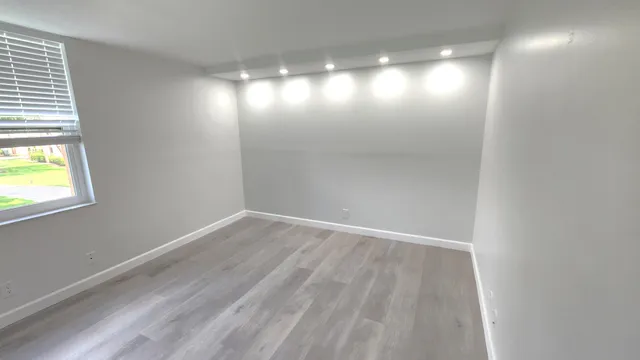 a view of an empty room with a window