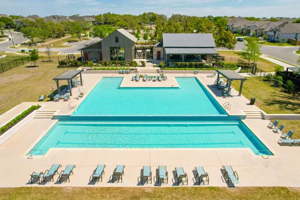 a view of a swimming pool with lounge chair
