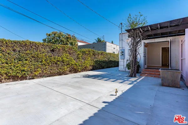 a view of a backyard of the house