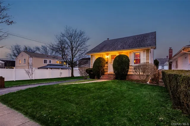 a view of a backyard with a sitting area