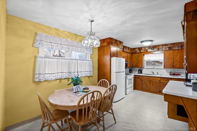 a dining room with a table and chairs
